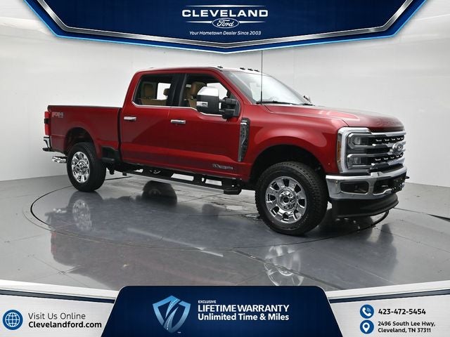 2026 Ford F-350SD Lariat in Ruby Red Metallic Tinted Clearcoat — front three-quarter view