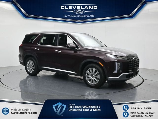 2024 Hyundai Palisade SEL 7 Passenger in Sierra Burgundy — front three-quarter view