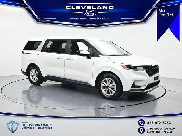 2022 Kia Carnival LXS in Snow White Pearl — front three-quarter view